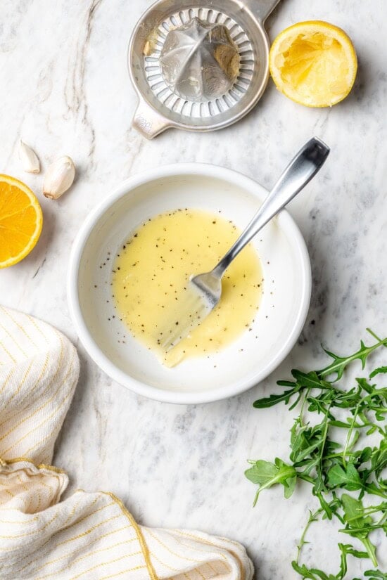 Overhead view of mojo vinaigrette in bowl with fork