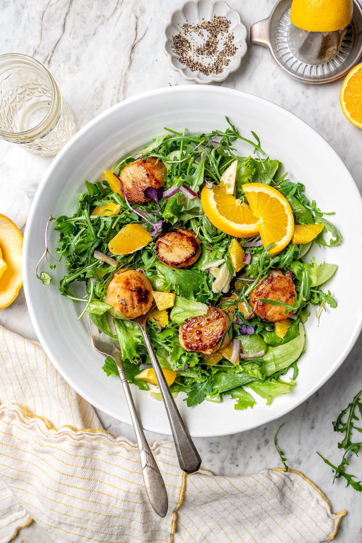 Pan seared scallops in serving bowl with citrus salad