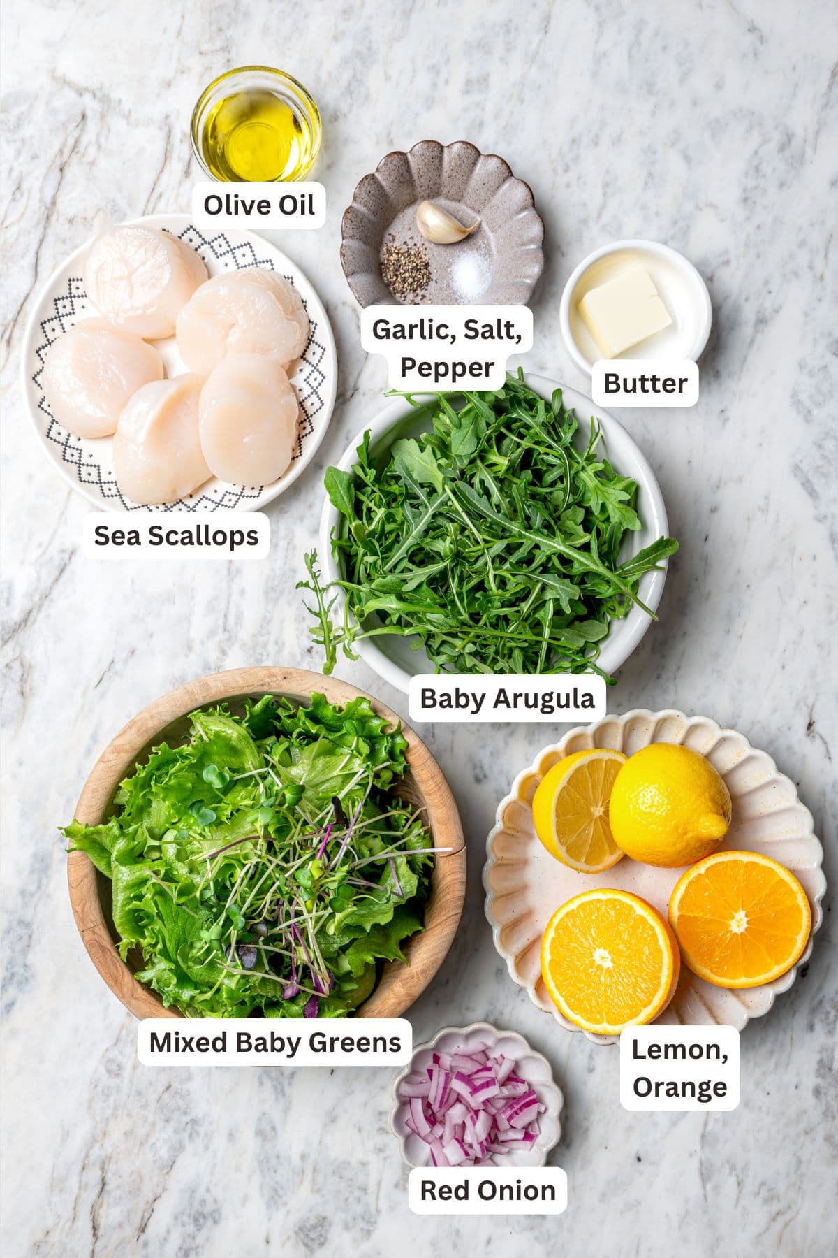 Overhead view of ingredients for seared scallops and salad