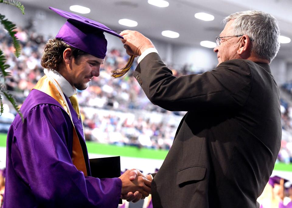 Wylie ISD Superintendent Joey Light congratulates a Wylie High School graduate in this May 24 Reporter-News file photo.