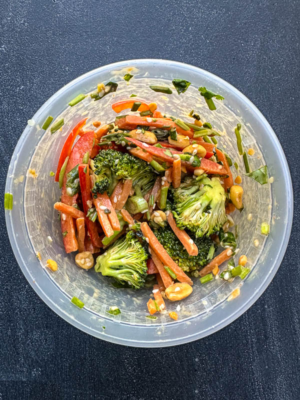 Thai Broccoli Salad – A crunchy, vibrant salad packed with bold flavors. Tossed with a zesty peanut dressing, this refreshing dish is perfect for meal prep, potlucks, or a light, nourishing meal. Find the recipe on Shutterbean.com #healthyrecipes #mealprep #saladlove #eattherainbow