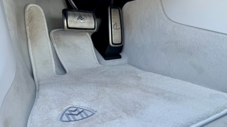 close-up of the Maybach SL's pedal box with dirty white floor mats