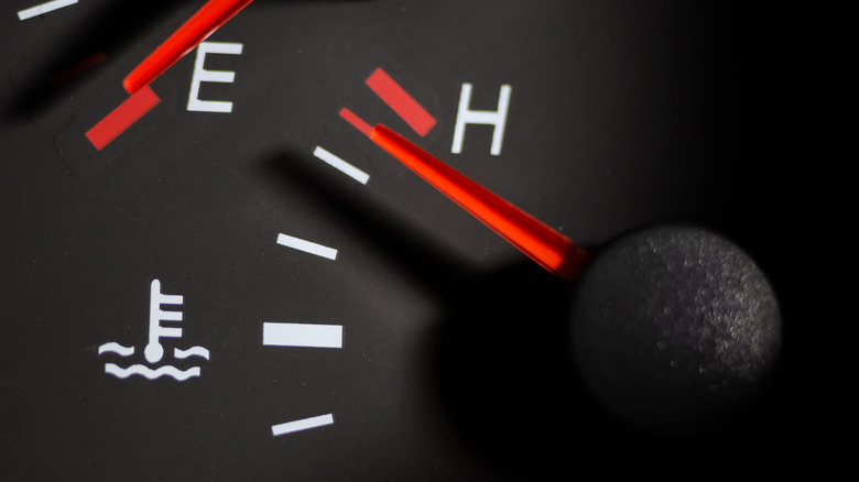 Close up of engine temperature gauge nearing hot.
