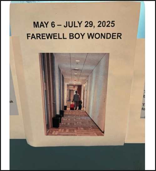 A printed sign reads "May 6 – July 29, 2025 Farewell Boy Wonder" above a photo of a person with luggage walking down a hallway. The sign is taped to a surface.