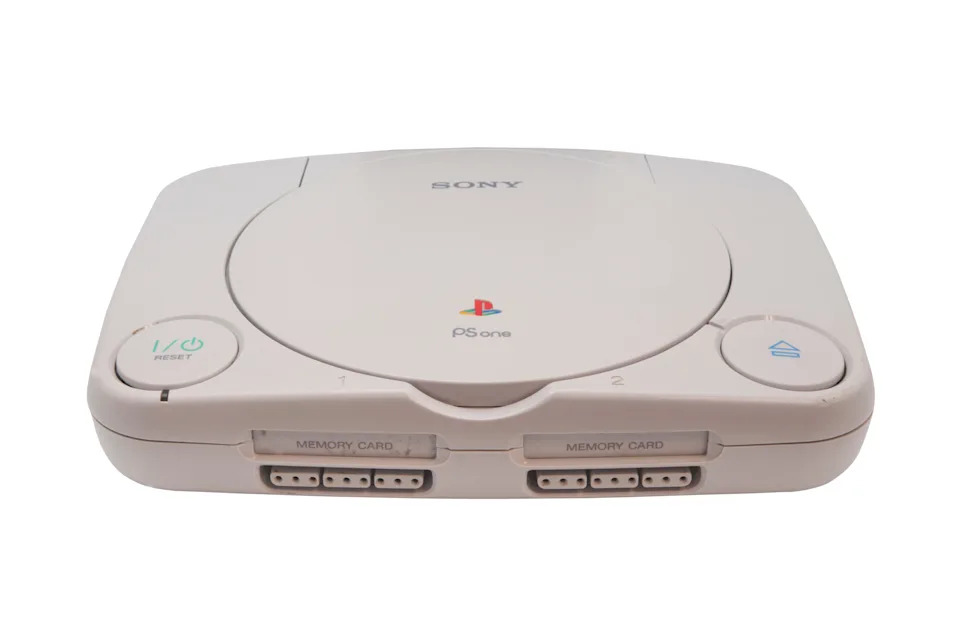 Sony PS One console, front view, showing two memory card slots and buttons