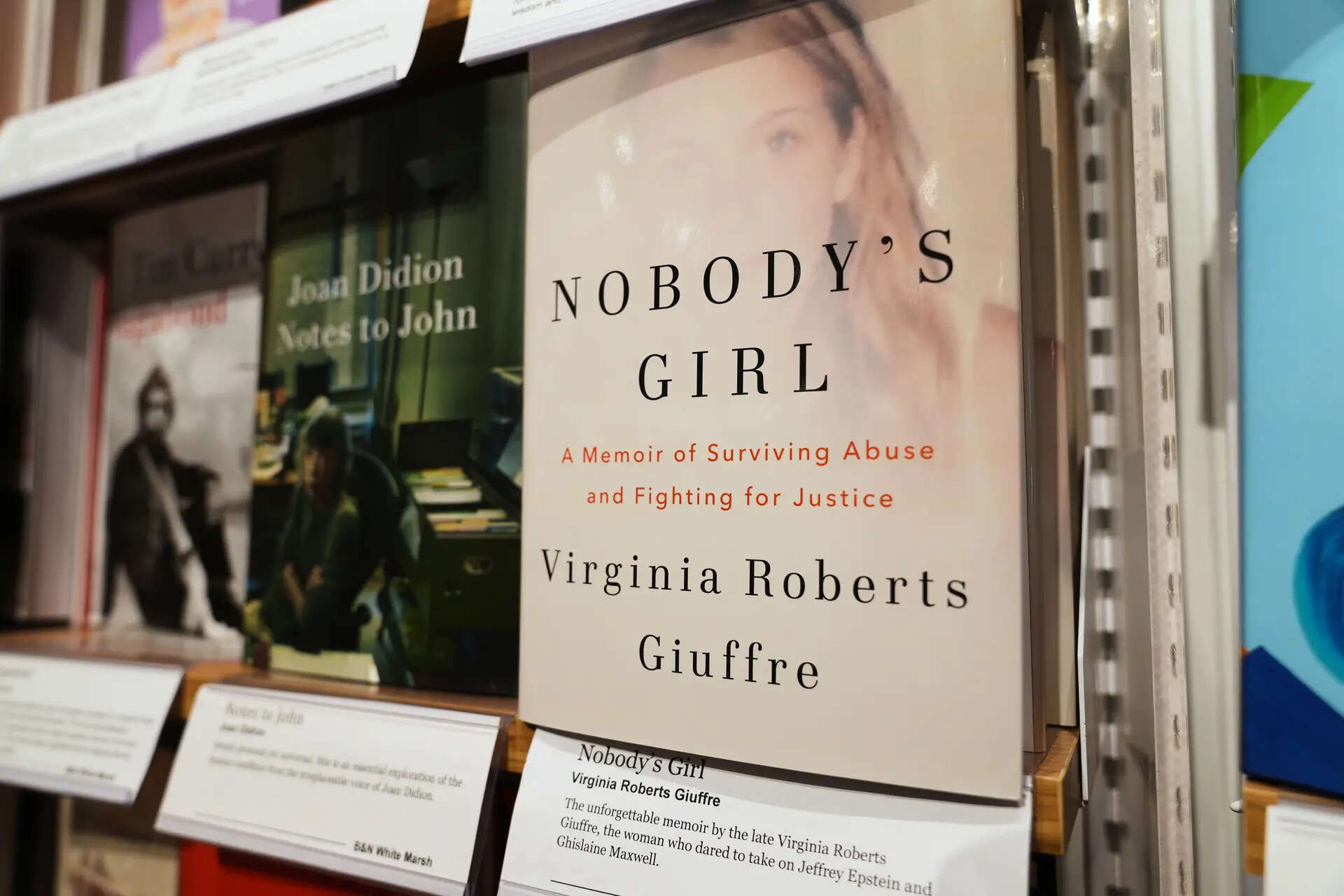 A copy of "Nobody's Girl: A Memoir of Surviving Abuse and Fighting for Justice" by Virginia Roberts Giuffre is displayed on a shelf at a Barnes & Noble Booksellers store, Tuesday, Oct. 21, 2025, in Baltimore. (AP Photo/Stephanie Scarbrough) Virginia Giuffre Memoir
