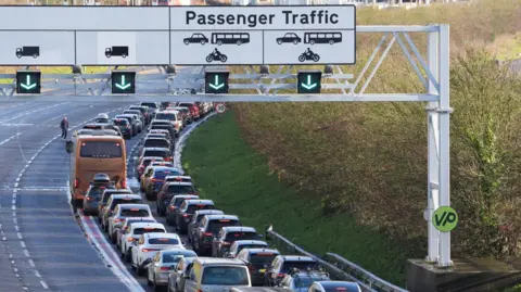 PA Media Passengers queue to enter the Eurotunnel site in Folkestone in Kent
